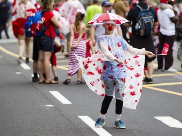Erin Saunderson, 10, from Uxbridge, dances on Wellington St. during Canada Day celebrations in downtown Ottawa Saturday, July 1, 2017.