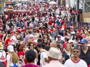 Thousands of people walk along Rideau St.  during Canada Day celebrations in downtown Ottawa Saturday, July 1, 2017.