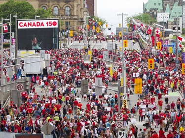 Thousands of people walk along Rideau St.  during Canada Day celebrations in downtown Ottawa Saturday, July 1, 2017.