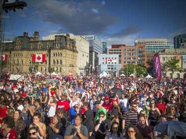 Large crowds didn't let a little rain stop them from coming out to enjoy WE Day Canada Sunday July 2, 2017 on Parliament Hill.