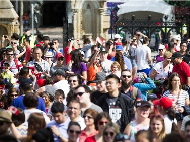 People in the crowd during WE Day Canada Sunday July 2, 2017 on Parliament Hill.