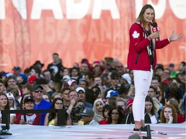 Olympic-champion swimmer Penny Oleksiak addresses the spectators from the WE Day Canada stage.