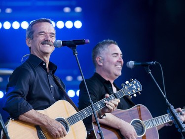 Canadian astronaut Chris Hadfield, left, performs on stage with Barenaked Ladies member Ed Robertson.