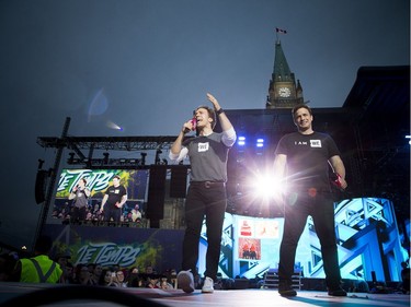 L-R Craig Kielburger and his brother Marc Kielburgerduring who started WE Day came out on stage Sunday July 2, 2017 on Parliament Hill.