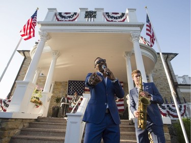 Singer Sean Jones, left, performs with his band, including saxophonist, Miles Raine, right, during the July 4th party at Lornado, the official residence of the United States Ambassador to Canada, Tuesday, July 4, 2017.