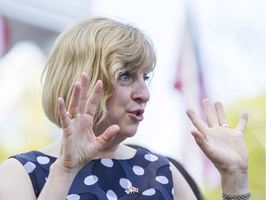 Chargé d'Affaires Elizabeth Aubin welcomes guests during the July 4th party at Lornado, the official residence of the United States Ambassador to Canada, Tuesday, July 4, 2017.