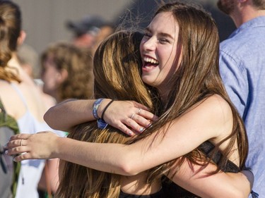 Brooklyn, left, embraces her friend, Evelyn while listening to Tribe Royal during the opening night of the 2017 Ottawa Bluesfest Thursday, July 6, 2017. (Darren Brown/Postmedia) NEG: 126895
Darren Brown, Postmedia