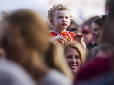 A young child without ear protection listens to the Sam Roberts Band perform during the opening night of the 2017 Ottawa Bluesfest Thursday, July 6, 2017. (Darren Brown/Postmedia) NEG: 126895
Darren Brown, Postmedia