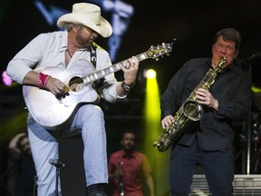 Toby Keith, left, performs during the opening night of the 2017 Ottawa Bluesfest Thursday, July 6, 2017.
