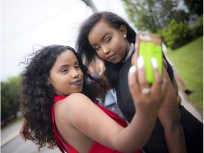 Rideau High School held a prom for the last graduating class Wednesday June 28, 2017, as the school has closed the doors permanently.   -- L-R 18-year-old Ayan Mohamed and 19-year-old Asha Dahir Hassan took a selfie outside the school before the big event kicked off.   Photos by Ashley Fraser/Postmedia
Ashley Fraser, Postmedia