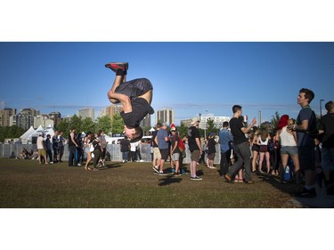 Twenty-year-old George Smith wasn't on his cellphone but instead doing flips to kill time in front of the City Stage.