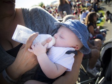 Three-and-a-half-month-old Jacob Pilote has a little snack at his first concert.