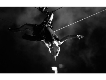 P!nk flies over the crowd during the encore of her performance at RBC Bluesfest on Sunday.   Ashley Fraser/Postmedia