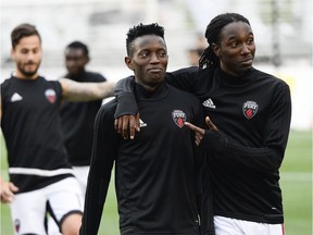 Fury FC players Azake Luboyera (17) and Jimmy-Shammer Sanon (24) walk together after the warm up at the friendly match between Fury FC and Montreal Impact held at TD Place on Wednesday, July 12, 2017