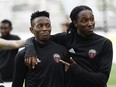 Azake Luboyera, left, with Fury FC's Jimmy-Shammer Sanon before an earlier game on July 12. James Park/Postmedia