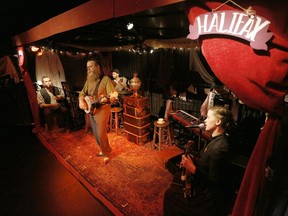 Singer and performer, Ben Caplan, centre, plays The Wanderer along with castmates, from left, Chris Weatherstone, Jamie Kronick, Graham Scott and Mary Fay Coady in Hannah Moscovitch's Old Stock A Refugee Love Story directed by Christian Barry showing at the National Arts Centre Thursday, July 13, 2017. (Darren Brown/Postmedia) Neg: 127105

0714 old stock 127105
Darren Brown, Postmedia