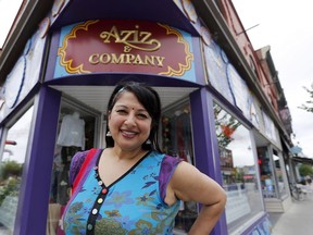 Sheena Zain, owner of Aziz & Company, in front of her store at the corner of Bank and Gilmour Sts.