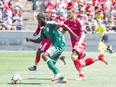 Fury FC defender Kyle Venter marks the Rhinos' Kenardo Forbes during Saturday's USL match at TD Place stadium.   Ashley Fraser/Postmedia