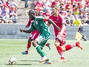 Fury FC defender Kyle Venter marks the Rhinos' Kenardo Forbes during Saturday's USL match at TD Place stadium.   Ashley Fraser/Postmedia