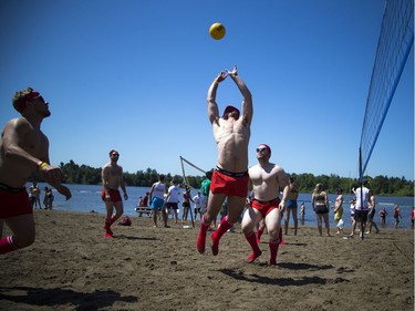 The hot sun made for perfect weather for HOPE Volleyball SummerFest that took over Mooney's Bay Park Saturday July 15, 2017. Martin Landriault of the Hit Faced team makes a play during the game Saturday.