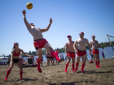 The hot sun made for perfect weather for HOPE Volleyball SummerFest that took over Mooney's Bay Park Saturday July 15, 2017. Nick Rouleau of the Hit Faced team goes up to hit the ball during a game.
