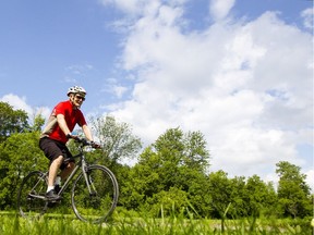 Ottawa Citizen reporter Wayne Scanlan rides his bike.