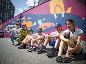 Ottawa School of Art's Canada 150 Project Illunaata, which means "all together" in Inuktitut, unveiled the mural on the side of 87 George St. Sunday July 16, 2017. L-R Alexa Hatanaka (a guide for Embassy of Imagination) and the youth from Kinngait who created the mural Parr Josephee, Christine Adamie, Kevin Qimirpik, Harry Josephee and Janice Qimirpik.