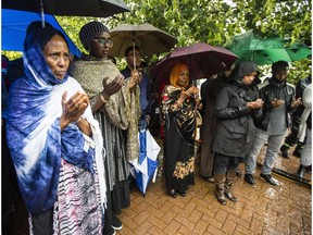 Members of the somali and Somerset community pray during a gathering to mark the one year anniversary of the death of Abdirahman Abdi Monday, July 24, 2017.