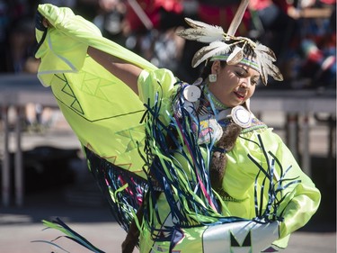 An Indigenous dancer performs during a special ceremony for La Machine where Long Ma, the dragon-horse, is awoken with a special ceremony on Marion Dewar Plaza at Ottawa City Hall on Friday. Darren Brown/Postmedia