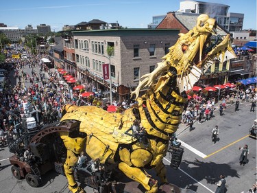 Long Ma, the dragon-horse, makes her way through the Byward Market during a La Machine performance Friday, July 28, 2017.