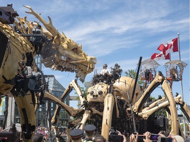 Long Ma, the dragon-horse, left, encounters Kumo, the spider, at the National Gallery during a La Machine performance on Friday.