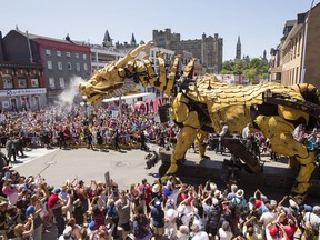 Long Ma, the horse-dragon, passes Inspiration Village as he makes his way through the Byward Market during a La Machine performance Saturday, July 29 2017.