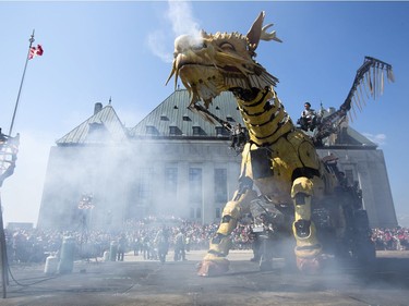 Long Ma, the horse-dragon, awakens as thousands of people look on outside the Supreme Court of Canada building on Sunday. Darren Brown/Postmedia
