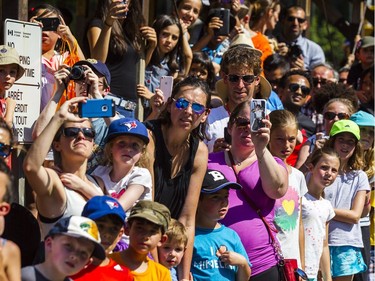 Thousands of people look on outside the Supreme Court of Canada to watch the La Machine afternoon show on Sunday. Darren Brown/Postmedia