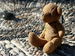 "Lonely" the bear - previously used as a therapeutic teddy bear by victims of abuse in clinics and shelters - sits atop thousands of tiny pebbles, inlayed by hand in a new commemoration site to be unveiled in Eganville on Saturday.  The Countdown Pebble Mosaic is one of four monuments being installed around Renfrew County to commemorate survivors of sexual violence. This mosaic weighs 3.5 tonnes and was inlaid with thousands of pebbles by members of the community and fellow survivors.  Julie Oliver/Postmedia
Julie Oliver, Postmedia