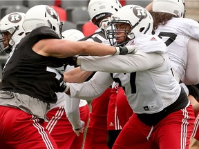 Eric Lofton, right, seen here during training camp, will make his first CFL start at left guard for the Redblacks against the Argonauts on Saturday night. Julie Oliver/Postmedia