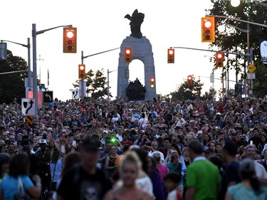 Crowds wait for Long Ma, the horse-dragon, on Elgin Street during the La Machine performance in Ottawa on Saturday, July 29, 2017.