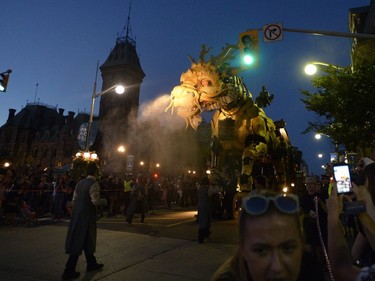 Long Ma, the horse-dragon, breathes out as she passes Parliament Hill during the La Machine performance in Ottawa on Saturday, July 29, 2017.