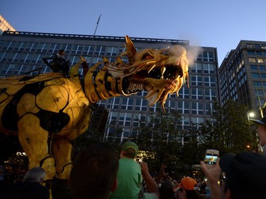 Long Ma, the horse-dragon, breathes out as she walks on Elgin Street during the La Machine performance in Ottawa on Saturday, July 29, 2017.