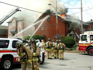A three-alarm fire kept local firefighters hopping at a duplex at the corner of Concord Street North and Greenfield downtown Thursday (July 13, 2017) afternoon.  Julie Oliver/Postmedia
Julie Oliver, Postmedia