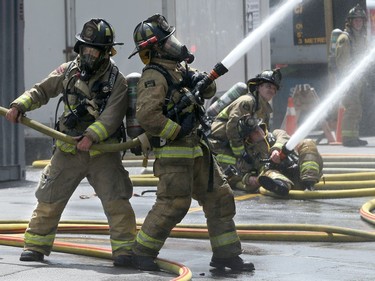 A three-alarm fire kept local firefighters hopping at a duplex at the corner of Concord Street North and Greenfield downtown Thursday (July 13, 2017) afternoon.  Julie Oliver/Postmedia
Julie Oliver, Postmedia