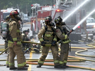 A three-alarm fire kept local firefighters hopping at a duplex at the corner of Concord Street North and Greenfield downtown Thursday (July 13, 2017) afternoon.  Julie Oliver/Postmedia
Julie Oliver, Postmedia