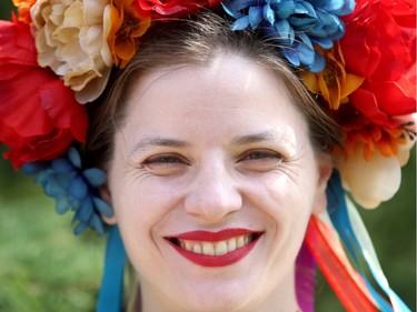 Kristina Dniprenko wears a traditional vinok on her head, festooned with flowers and ribbons. Traditionally, "maidens in Ukraine wore these - young, unmarried girls," she says.