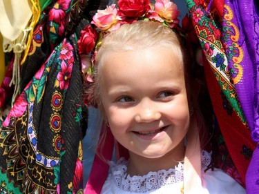 Yarvara Markarian, 8,  plays a game of peek-a-boo with her mom inside one of the traditional clothing booths.  The Capital Ukrainian Village welcomed an estimated 20,000 visitors on the weekend.