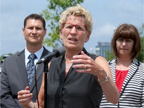 Ontario Premier Kathleen Wynne toured Blackberry QNX Autonomous Vehicle Innovation Centre in Kanata on Friday, and fielded questions about Hydro One purchasing a company with interests in a coal plant.