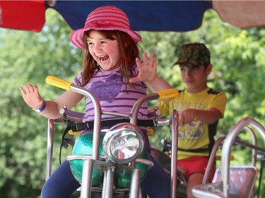 "Look ma, no hands." Abigail Bell has a blast on the midway, which kept kids entertained until the cultural programming kicked in later in the day at the 27th annual Ottawa Lebanese Festival at St. Elias Cathedral.