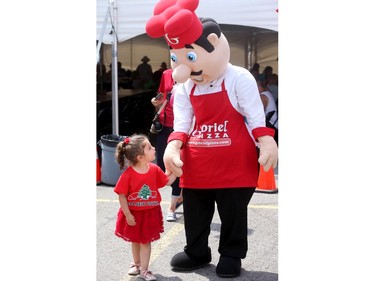 While at the Lebanese festival, Christa Abourjeili, 3, seemed enamoured with "Chef Gabe" from Gabriel Pizza at the food village.