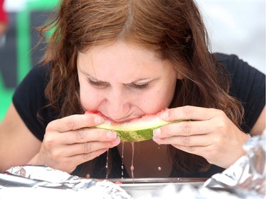Contestant Shawna Lee heartily digs into her plate of the sweet stuff during the watermelon-eating contest at the Lebanese festival.