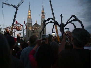 Kumo awakens atop Notre Dame Cathedral Basilica in Ottawa on Thursday evening.  Julie Oliver/Postmedia