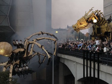 Kumo the spider and Long Ma the dragon-horse battled beside the Shaw Centre in downtown Ottawa in an epic fight scene that left the thousands of spectators in awe Friday (July 28, 2017) night. La Machine's mechanical spectacle continues in Ottawa's streets Saturday and Sunday. Julie Oliver/Postmedia